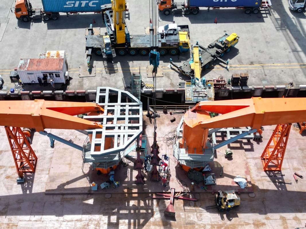 Cranes being installed on the barge deck